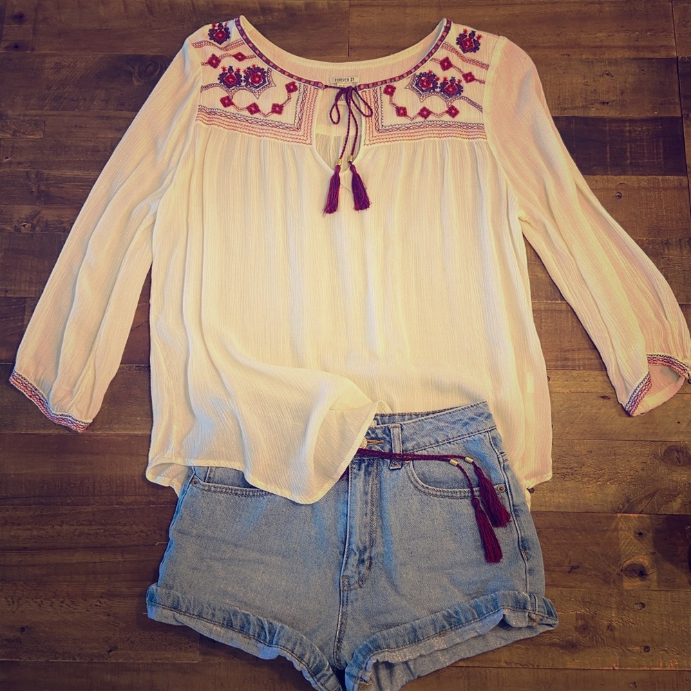 Off- white blouse with design.